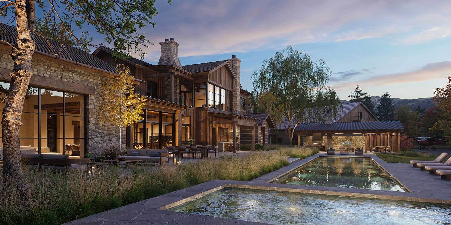 Exterior of a modern passive house showcasing large south-facing windows, natural stone walls for thermal mass, and shaded outdoor spaces for passive cooling.